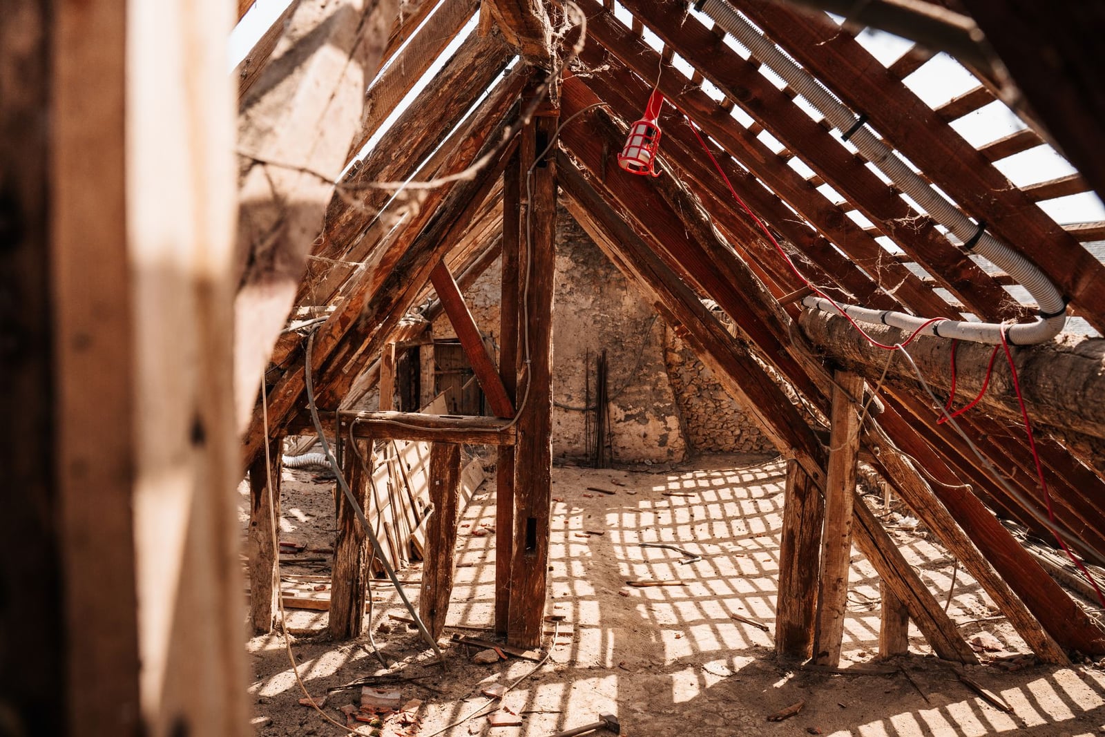 View of attic rafters and roof decking from underneath