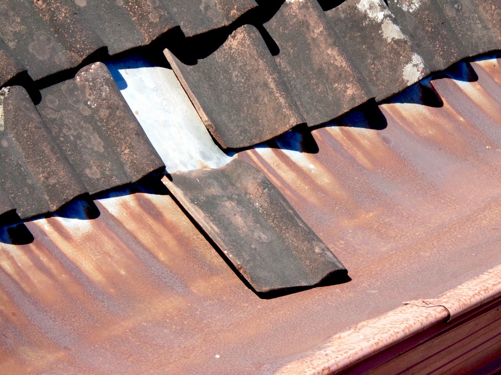 Damaged section of gutter pulling away from the roofline on a Huntington Beach home