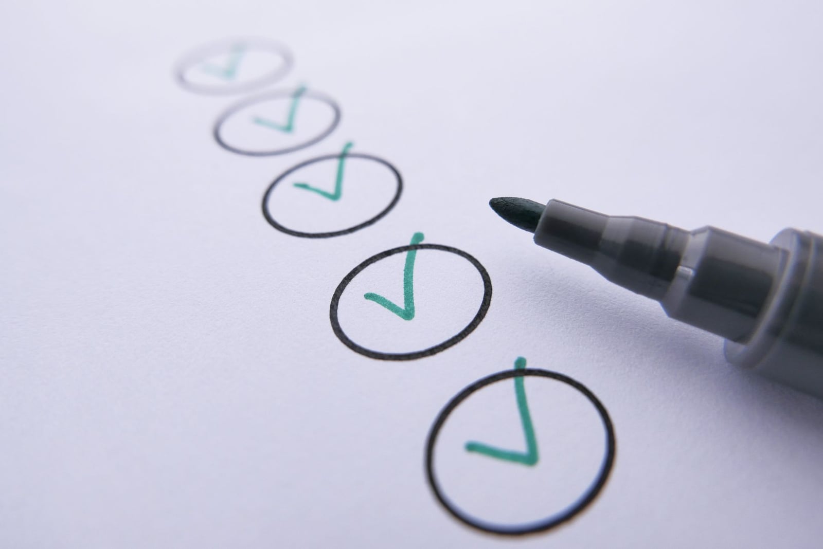 Marker checking off items on a checklist