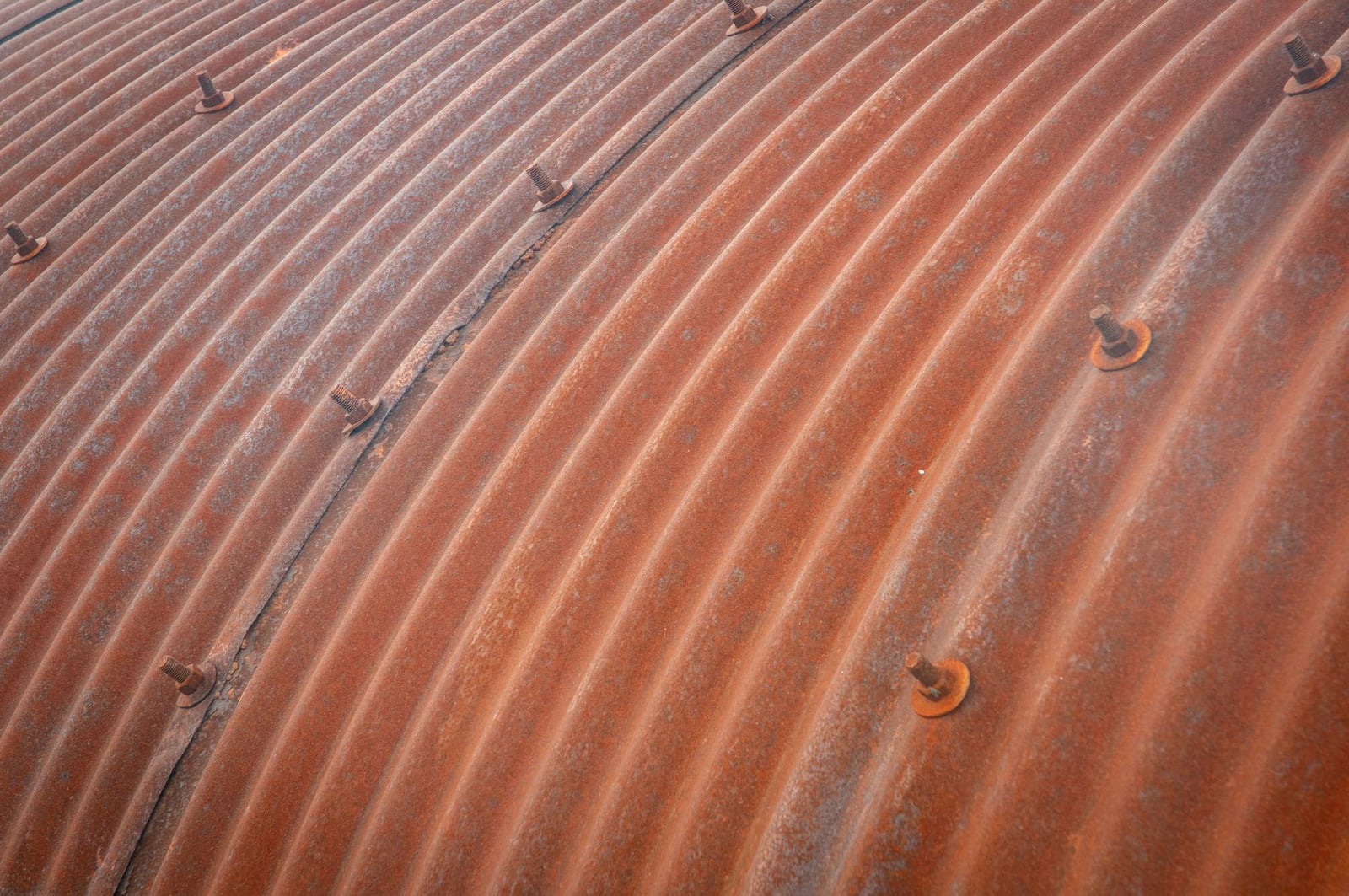 Corroded corrugated metal roofing surface
