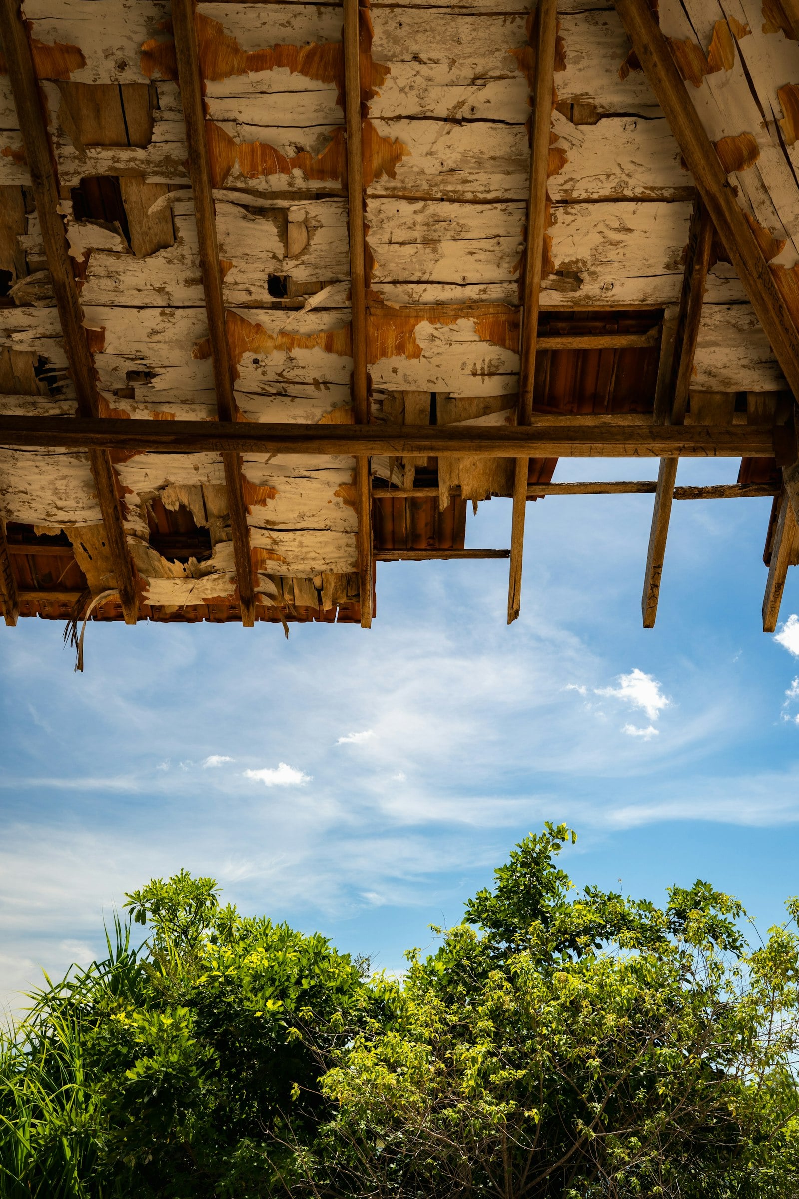 Damaged roof framing exposed once old roofing material is removed on a Huntington Beach home