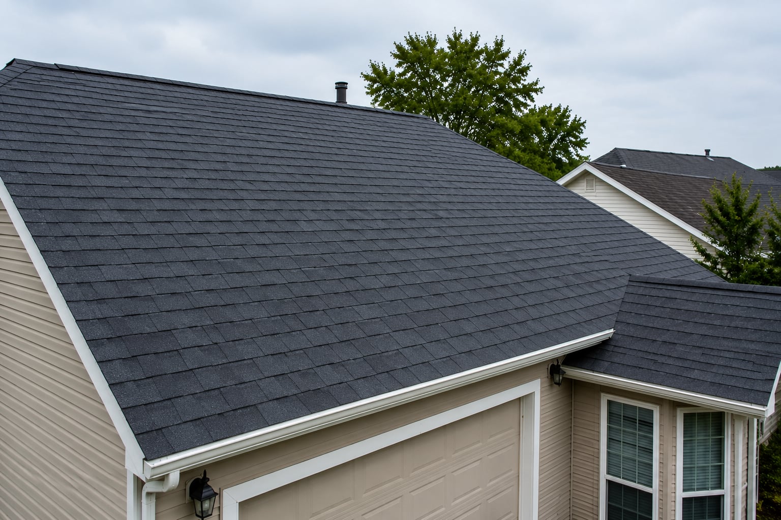 Roof after emergency repair, new shingles installed on a Huntington Beach home