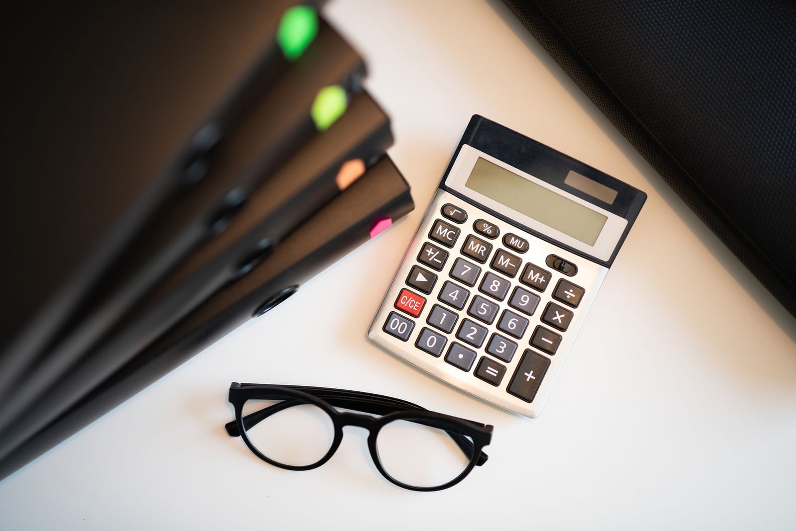 Calculator and financial documents on a desk