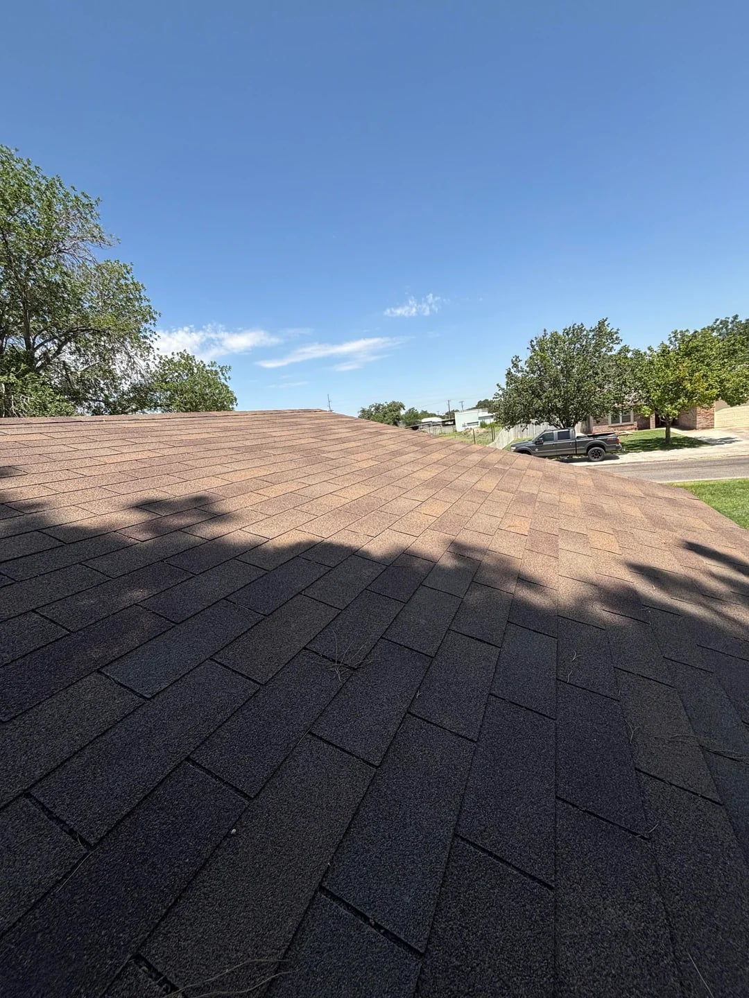 Roofline and chimney flashing on a completed Huntington Beach shingle roof