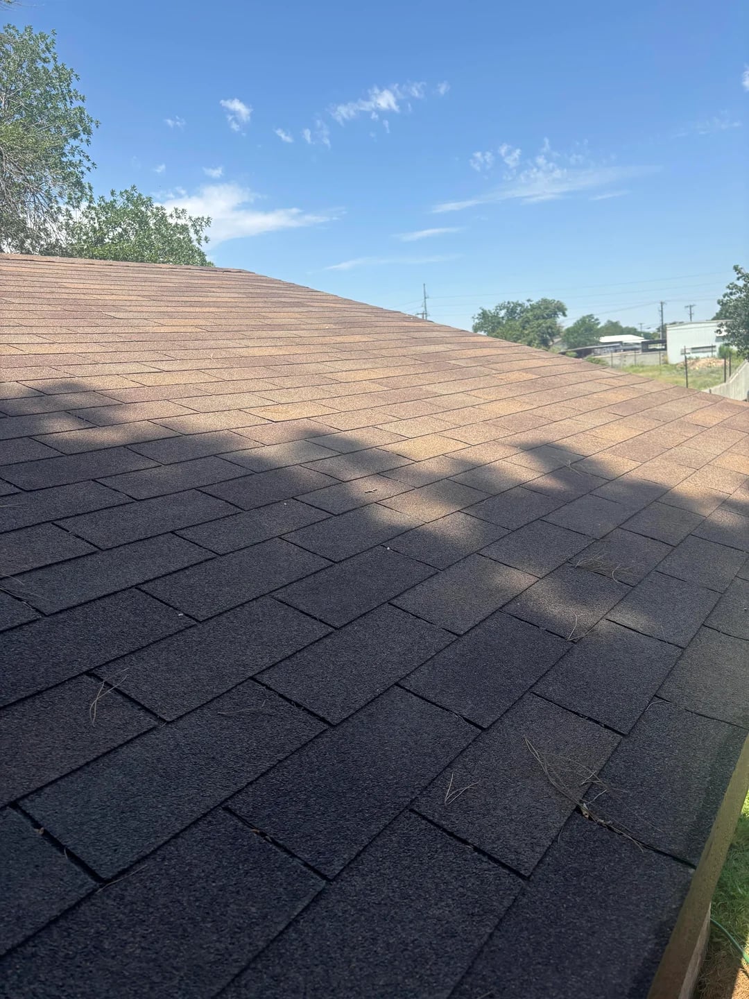 Completed shingle roofline on a Huntington Beach home
