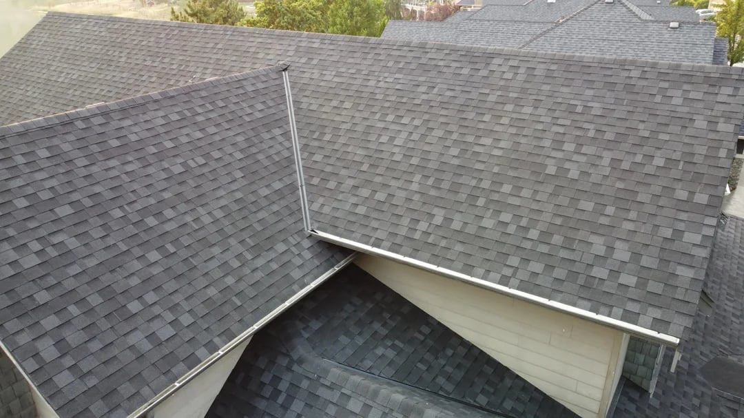 Aerial view of a shingle roof valley and gutter line on a Huntington Beach home