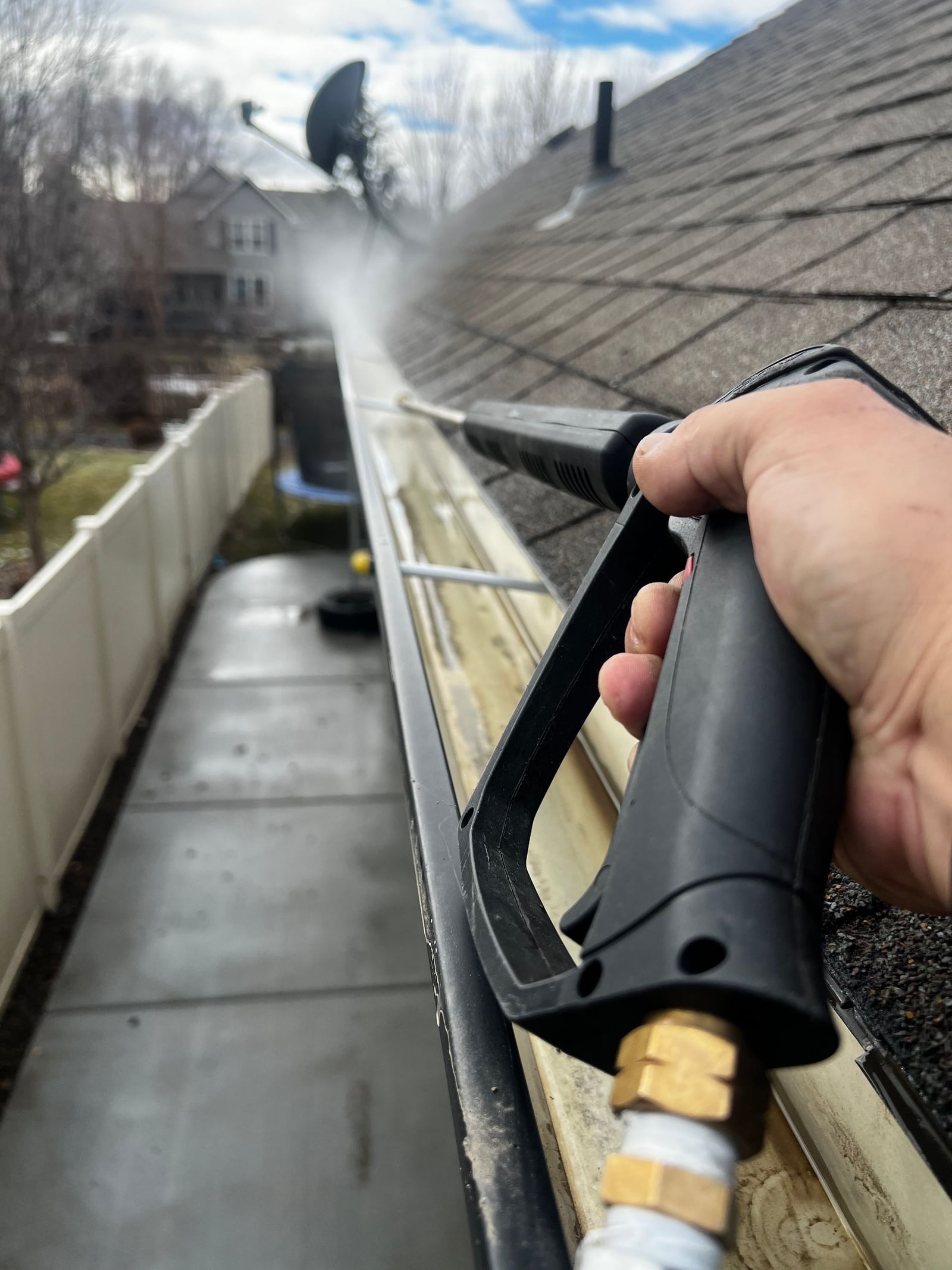 Gutter cleaning service removing debris