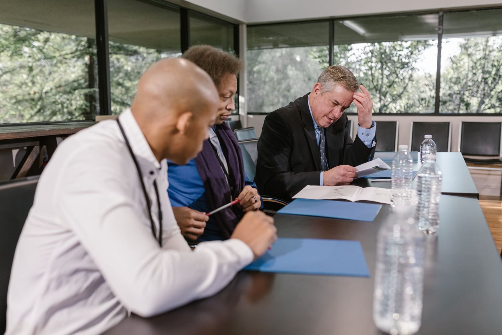 Group reviewing documents during a meeting