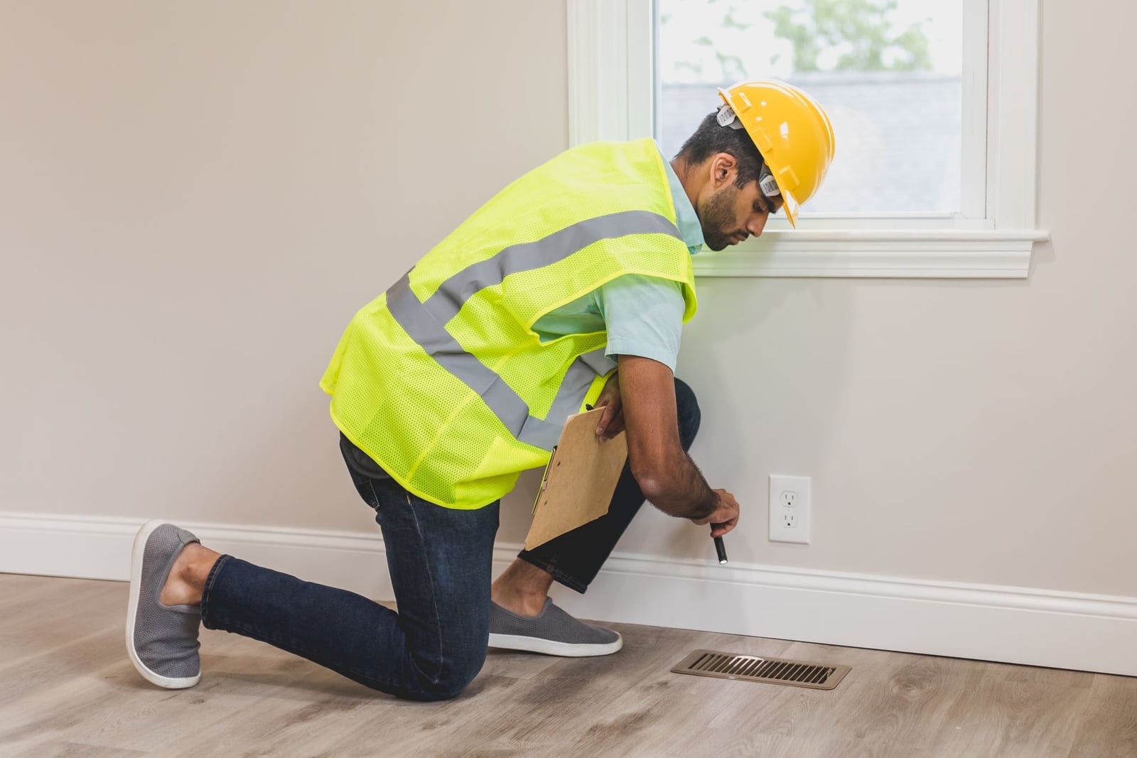Inspector checking a home's interior for damage