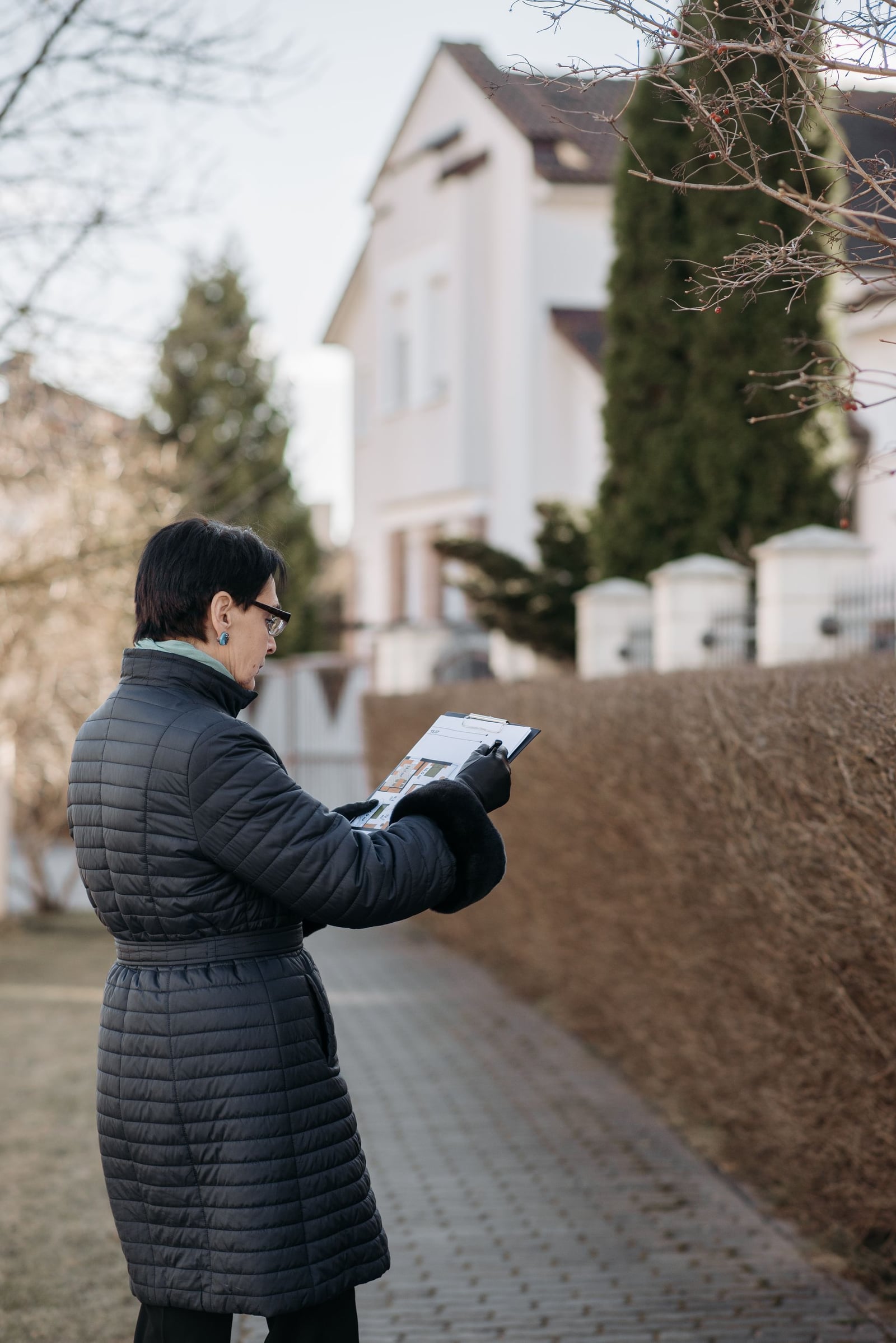 Reviewing a property appraisal document outside a home