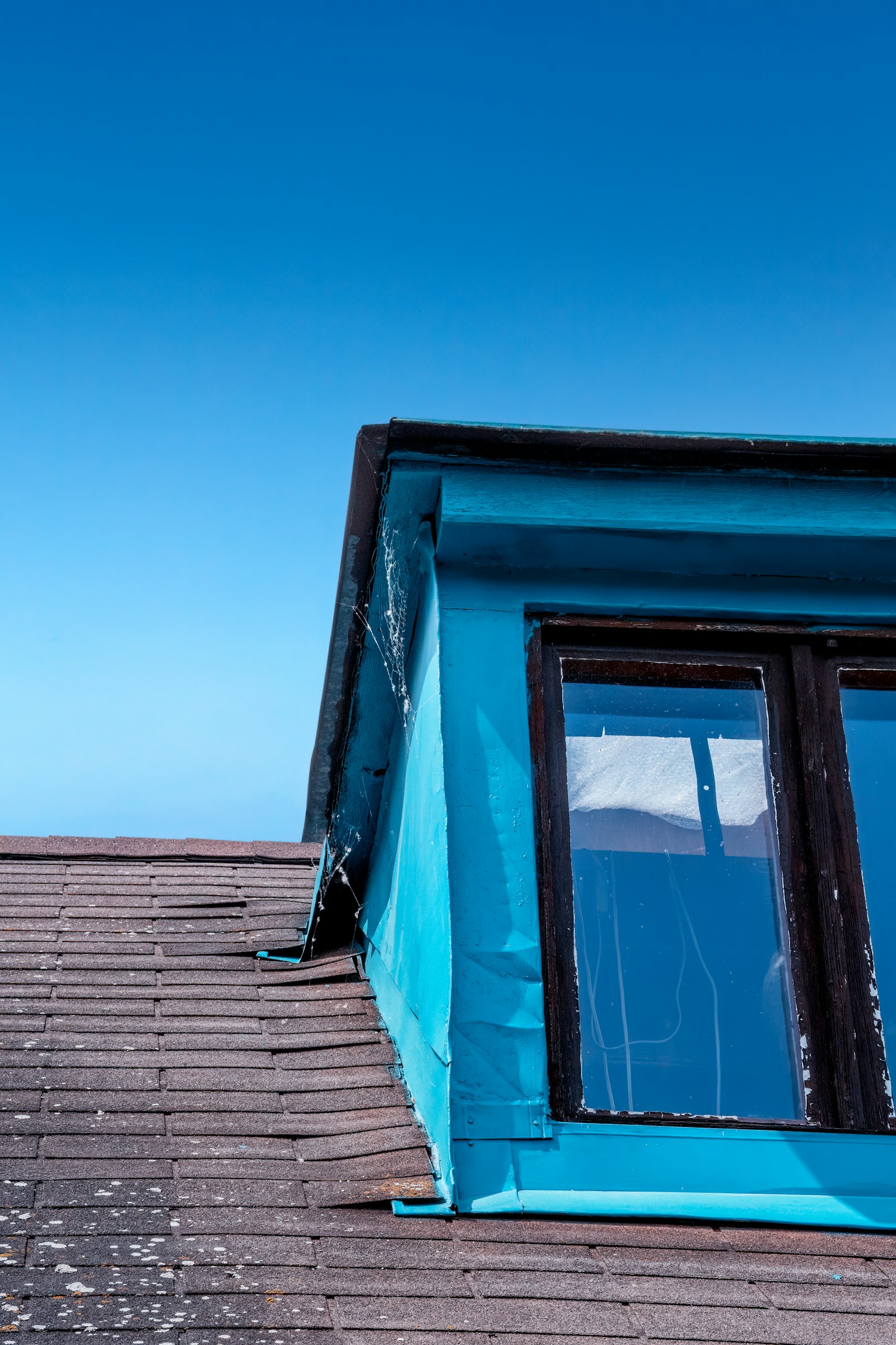 Roof inspection Huntington Beach — roof under a clear blue sky