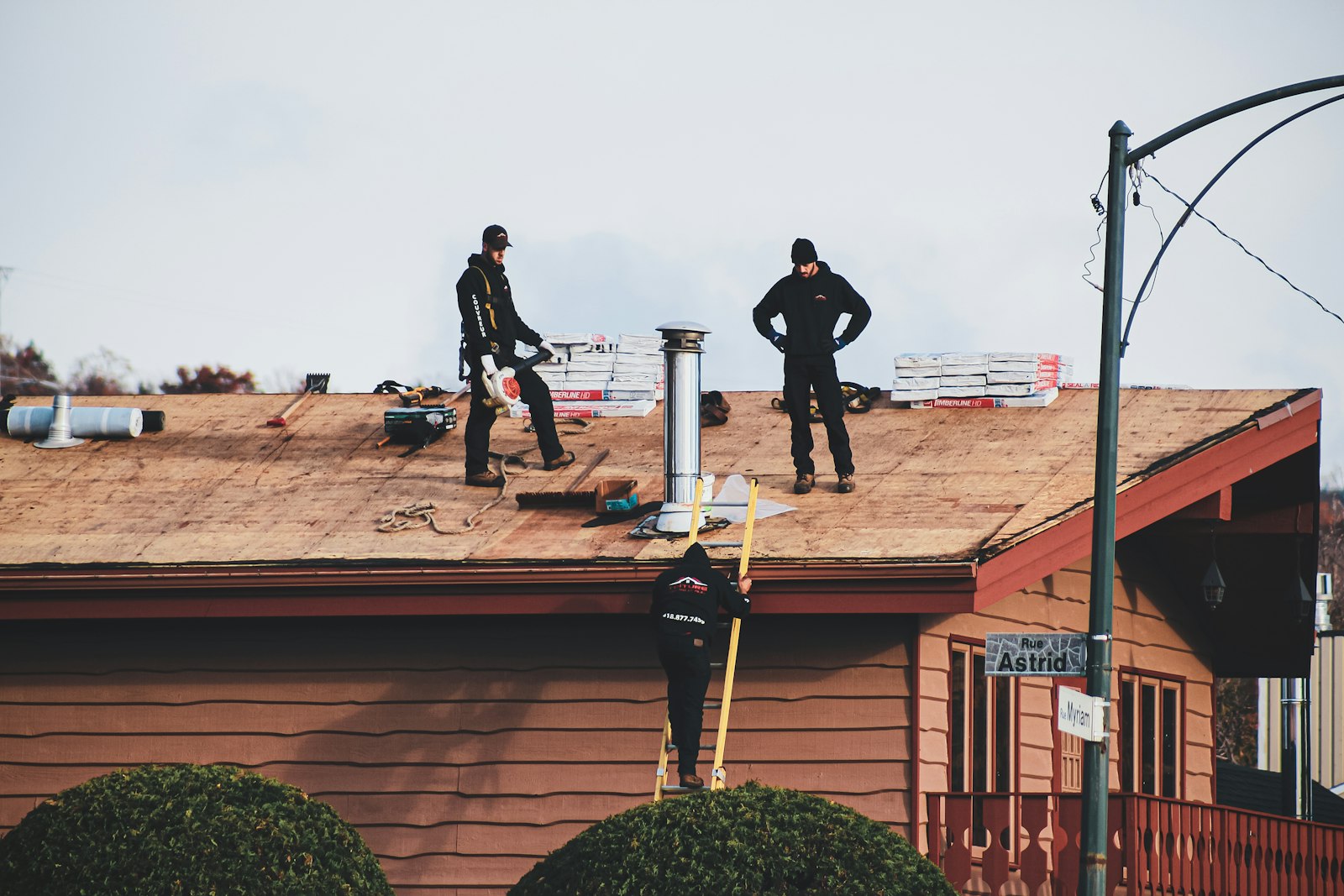 Roof replacement Huntington Beach — crew installing a new roof