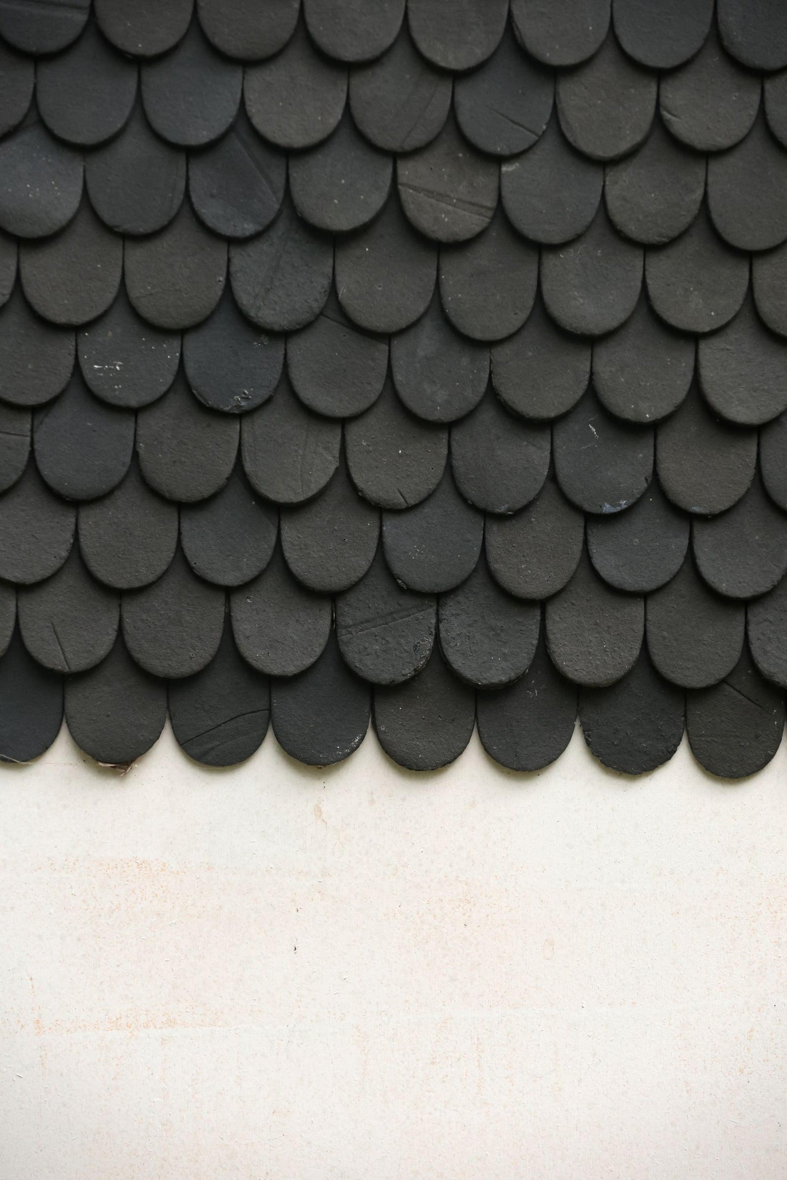 Close-up texture of dark roof shingles