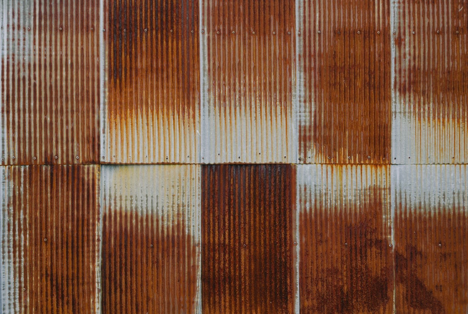 Close up of rust and corrosion on corrugated metal roofing panels