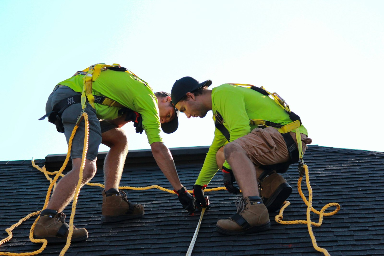 Shingle roof repair Huntington Beach — roofers repairing asphalt shingles