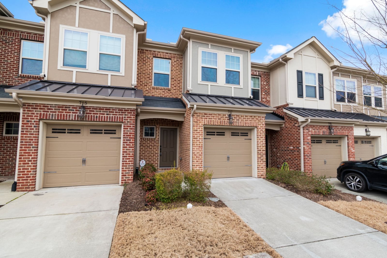 Row of townhomes with a shared continuous roofline