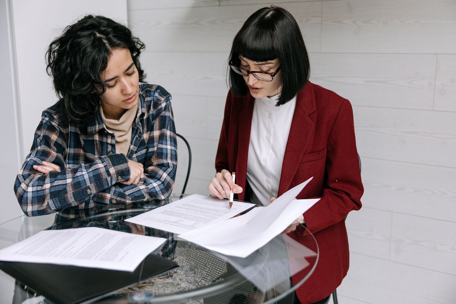 Two people reviewing a document together