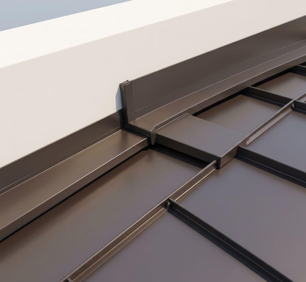 A close-up view of a modern standing seam metal roof system, featuring detailed flashing along the edge where it meets a vertical wall. Location: Huntington Beach, United States